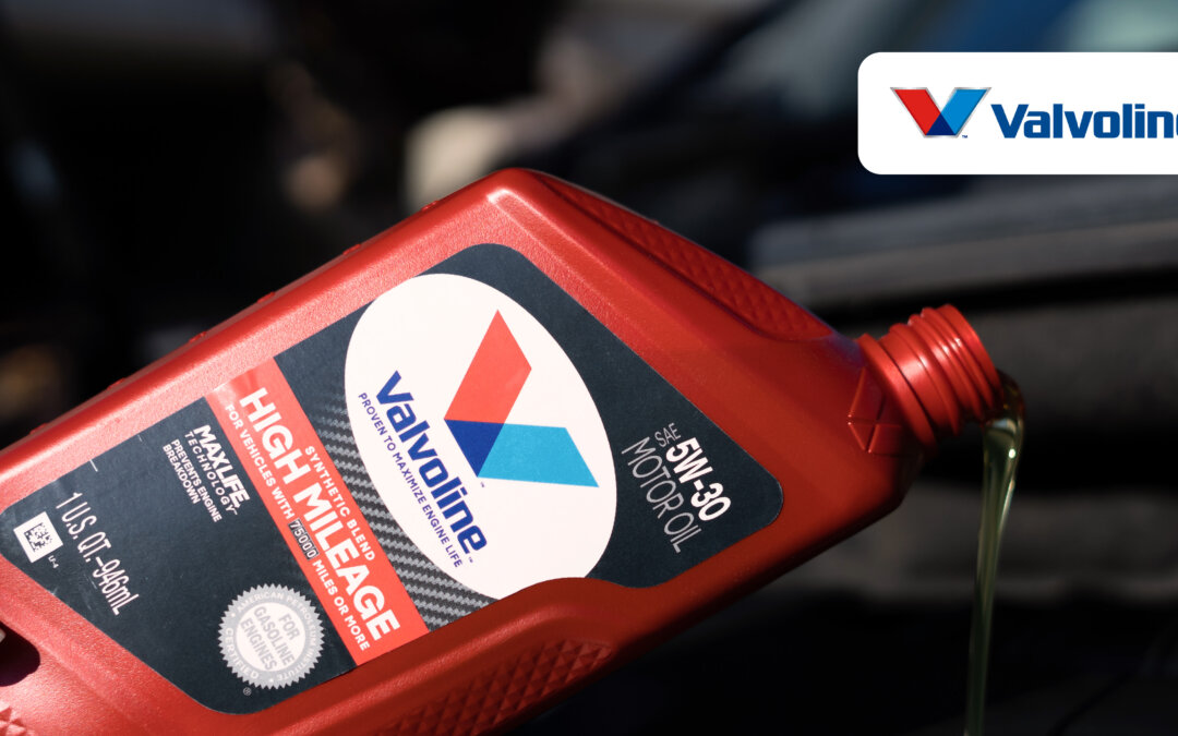 Valvoline header image, person pouring oil into vehicle